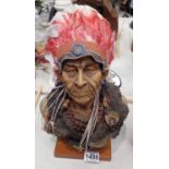 An Indian chief bust mounted on a wooden base, H: 33 cm. Not available for in-house P&P, contact