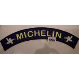 Cast iron Michelin Man curved sign, 40 x 7 cm. P&P Group 2 (£18+VAT for the first lot and £3+VAT for
