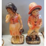 Pair of vintage 1930s cast plaster child figurines, each H: 35 cm. Not available for in-house P&P,