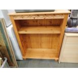 A pine bookcase with two shelves, 85 x 32 x 110 cm H. Not available for in-house P&P, contact Paul