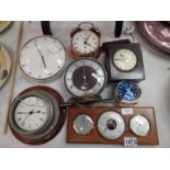 Six mixed clocks and a wall barometer. Not available for in-house P&P, contact Paul O'Hea at