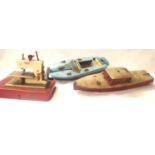 Hornby clockwork speedboat Venture, circa 1930s. Plus another battery operated tinplate boat. Also