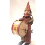 Japanese clockwork tinplate drumming clown with celluloid head, working mech with key, missing lower