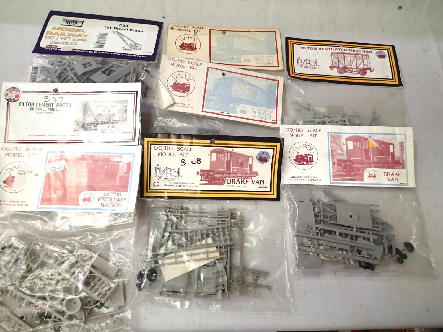 Eight Dapol OO scale plastic wagon kits, including 15t crane, mineral, brake, meat, cement,