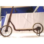 Vintage metal framed childs scooter, spoked wheels, rear brakes, stand and wooden footboard,