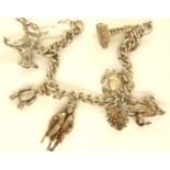 925 silver charm bracelet with seven charms to include an articulated teddy bear and Long John