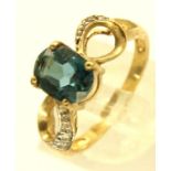 9ct gold blue topaz and diamond ring, with certificate, size N, 2.7g. P&P Group 1 (£14+VAT for the