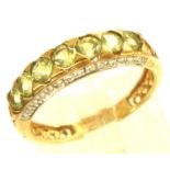 9ct gold peridot and diamond ring with certificate, size N, 2.2g. P&P Group 1 (£14+VAT for the first