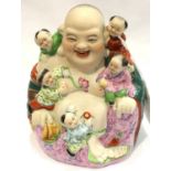 20th century Chinese Porcelain figure of Buddha with five boys playing around him, impressed marks