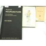 Three acupuncture books to include the Atlas of Acupuncture by Felix Mann and Acupuncture, The