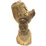 Large ethnic hand carved bust from a tree trunk L: 60 cm. P&P Group 3 (£25+VAT for the first lot and