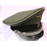 A German WWII replica SS officers visor cap. P&P Group 2 (£18+VAT for the first lot and £3+VAT for