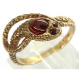 9ct gold snake ring with ruby set to head and ruby eyes, size R, 3.9g. P&P Group 1 (£14+VAT for