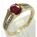 9ct gold ruby ring with diamond set shoulders, size O, 2.8g. P&P Group 1 (£14+VAT for the first