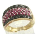 9ct gold ruby and black diamond ring, size P, 4.9g. P&P Group 1 (£14+VAT for the first lot and £1+