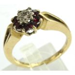 18ct gold ruby and diamond flower ring, size P/Q, 5.2g. P&P Group 1 (£14+VAT for the first lot