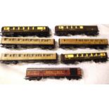 Seven OO scale coaches including three LNER Teak, three Pullman and T.P.O, in mostly good condition,