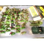 Approximately fifty Britains plastic soldiers, mostly WWII related, plus a scout car and silver