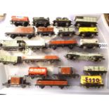 Twenty one Hornby Dublo three rail tinplate wagons, includes tankers, opens, brake vans, bogie