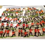 Approximately eighty Britains plastic soldiers, various types, in mostly good condition and some