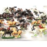 Thirty plastic Britains mounted soldiers, various types in mostly good condition. P&P Group 1 (£14+