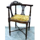 An Edwardian mahogany corner chair with studded upholstery. Not available for in-house P&P,