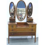 An Edwardian walnut bedroom chest and dressing table, each inlaid and fitted with drawers. (2) Not