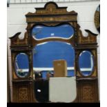 A large 19th century rosewood over mantel mirror, inlaid and with four shaped panels of glass,