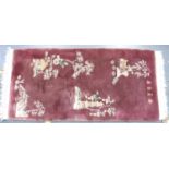 A modern pink ground Chinese thick pile floor rug decorated with Pagodas and Chinese characters,