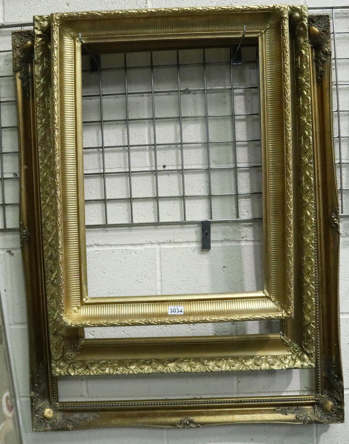 Two 19th century plaster gilt frames and a larger later gilt frame, interior sizes, 66 x 46, 81 x 56