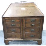 A late 18th/early 19th century oak bureau, of unusual corner form, having a fitted interior and