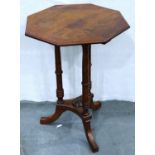 A 19th century walnut octagonal lamp table, with turned supports and three splayed feet, 50 x 50 x