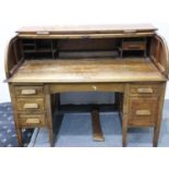 A Victorian oak roll top twin pedestal desk, with tambour front and fitted interior, 145 x 82 x