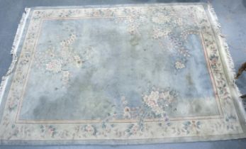 Large Chinese pure wool fringed rug green and beige ground with floral design, 274 x 170 cm. Not