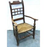 An 18th century oak rush seated elbow chair. Not available for in-house P&P, contact Paul O'Hea at
