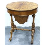 Victorian figured walnut ladies work table, oval form with hinged quarter cut top, enclosing a