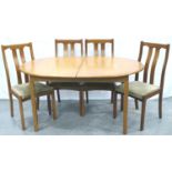 Meredew mid 20th century oval extending dining table with incorporated folding leaf and four chairs,