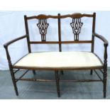 An Edwardian walnut framed two seat parlour chair, later upholstered. Not available for in-house P&