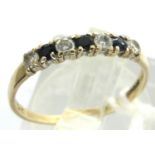 9ct gold ring set with three sapphires and four CZ, size M/N, 1.0g. P&P Group 1 (£14+VAT for the