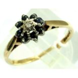 9ct gold daisy ring set with a central diamond and sapphires, size P, 1.8g. P&P Group 1 (£14+VAT for
