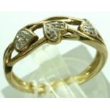 9ct gold pierced ring with three diamond hearts, size N/O, 2.2g. P&P Group 1 (£14+VAT for the