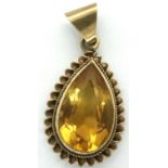 Yellow metal mounted citrine pendant, H: 14 mm, 1.9g. P&P Group 1 (£14+VAT for the first lot and £