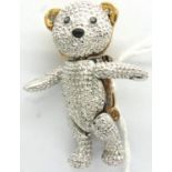 Yellow and white metal articulated stone set teddy bear brooch, H: 40 mm. P&P Group 1 (£14+VAT for