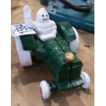 Cast iron Michelin man on a tractor, H: 80 mm. P&P Group 1 (£14+VAT for the first lot and £1+VAT for