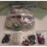 Forty bags of jewellery making stones and plastic beads. P&P Group 1 (£14+VAT for the first lot