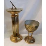 Brass sundial, H: 35 cm, and a brass chalice. Not available for in-house P&P, contact Paul O'Hea