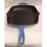 Blue Le Creuset grill pan. Not available for in-house P&P, contact Paul O'Hea at Mailboxes on