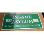 Cast iron Insane Asylum sign, 10 x 23 cm. P&P Group 1 (£14+VAT for the first lot and £1+VAT for