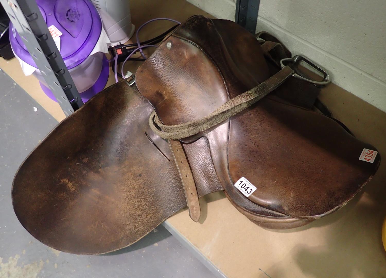 Brown leather horse saddle with stirrups. Not available for in-house P&P, contact Paul O'Hea at