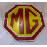 Cast iron MG hexagonal wall plaque, D: 24 cm. P&P Group 1 (£14+VAT for the first lot and £1+VAT